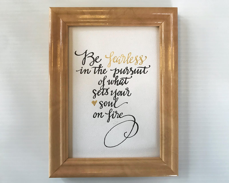 Hand Lettered Calligraphy Quote in black and gold ink, "Be fearless in the pursuit of what sets your soul on fire"